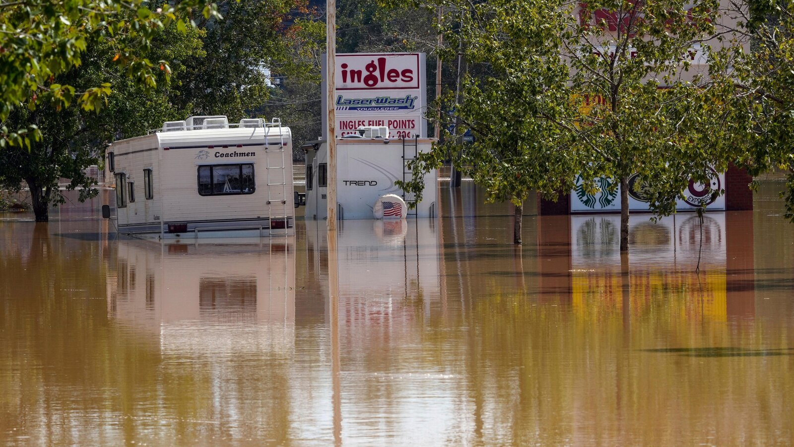 The Latest: Helene's death toll rises to nearly 100 as supplies rushed to isolated communities